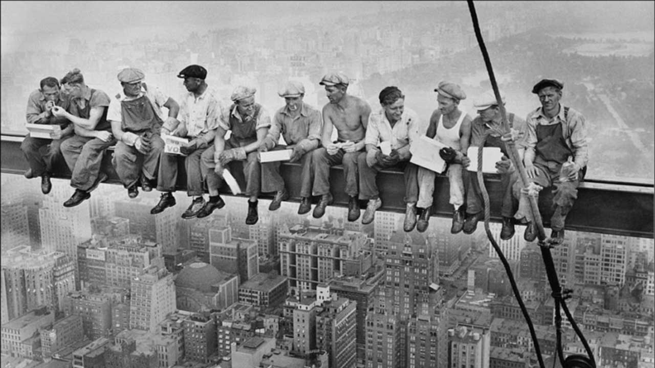 ironworkers having lunch atop a skyscraper