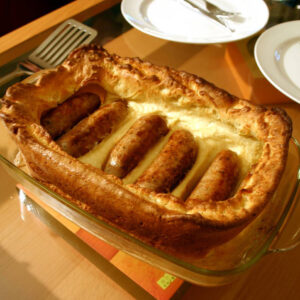 how did the british sausage dish toad in the hole originate and what does its name mean