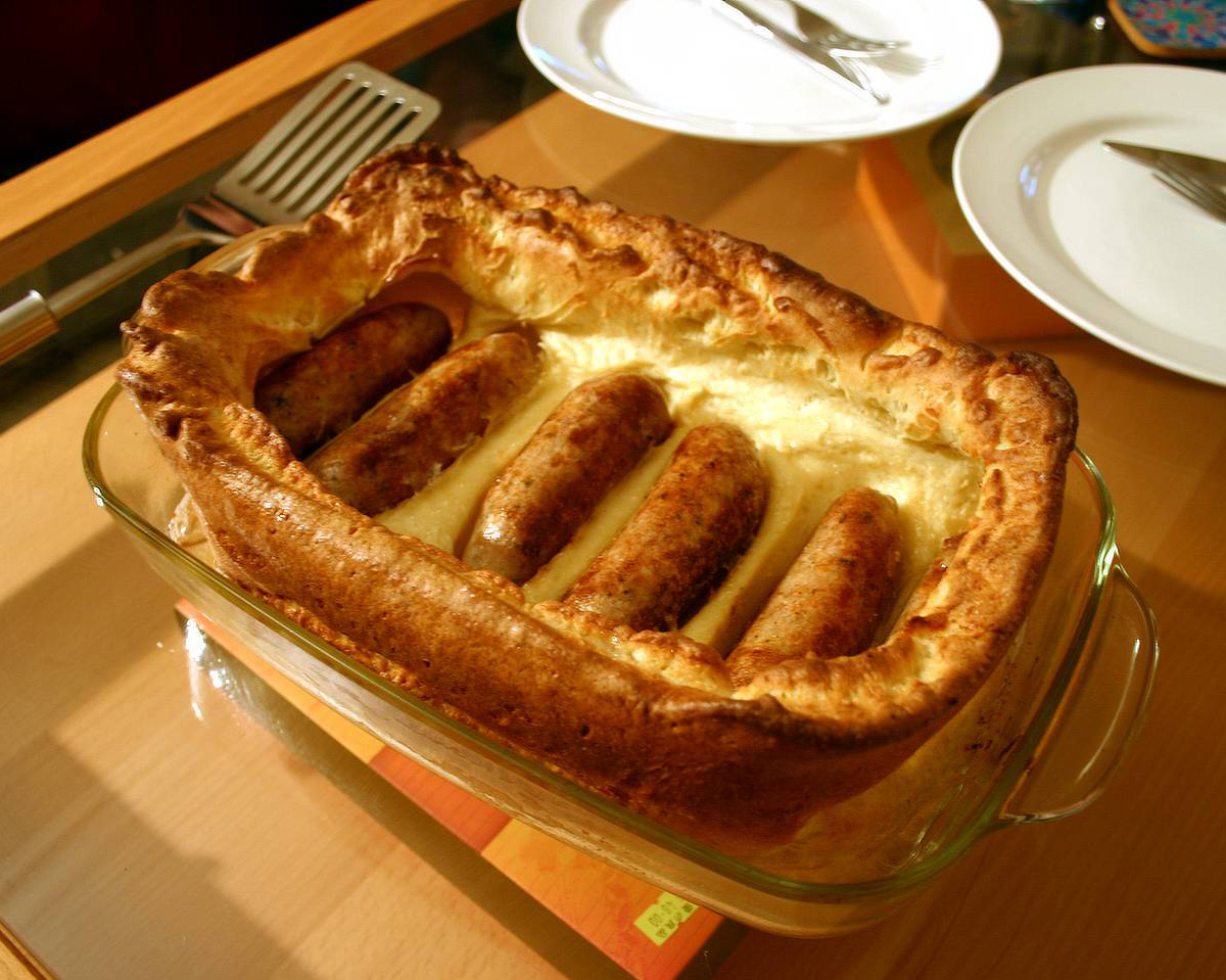 how did the british sausage dish toad in the hole originate and what does its name mean