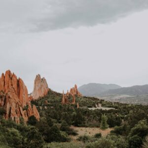 how did the garden of the gods in colorado springs get its name and what does colorado mean in spanish