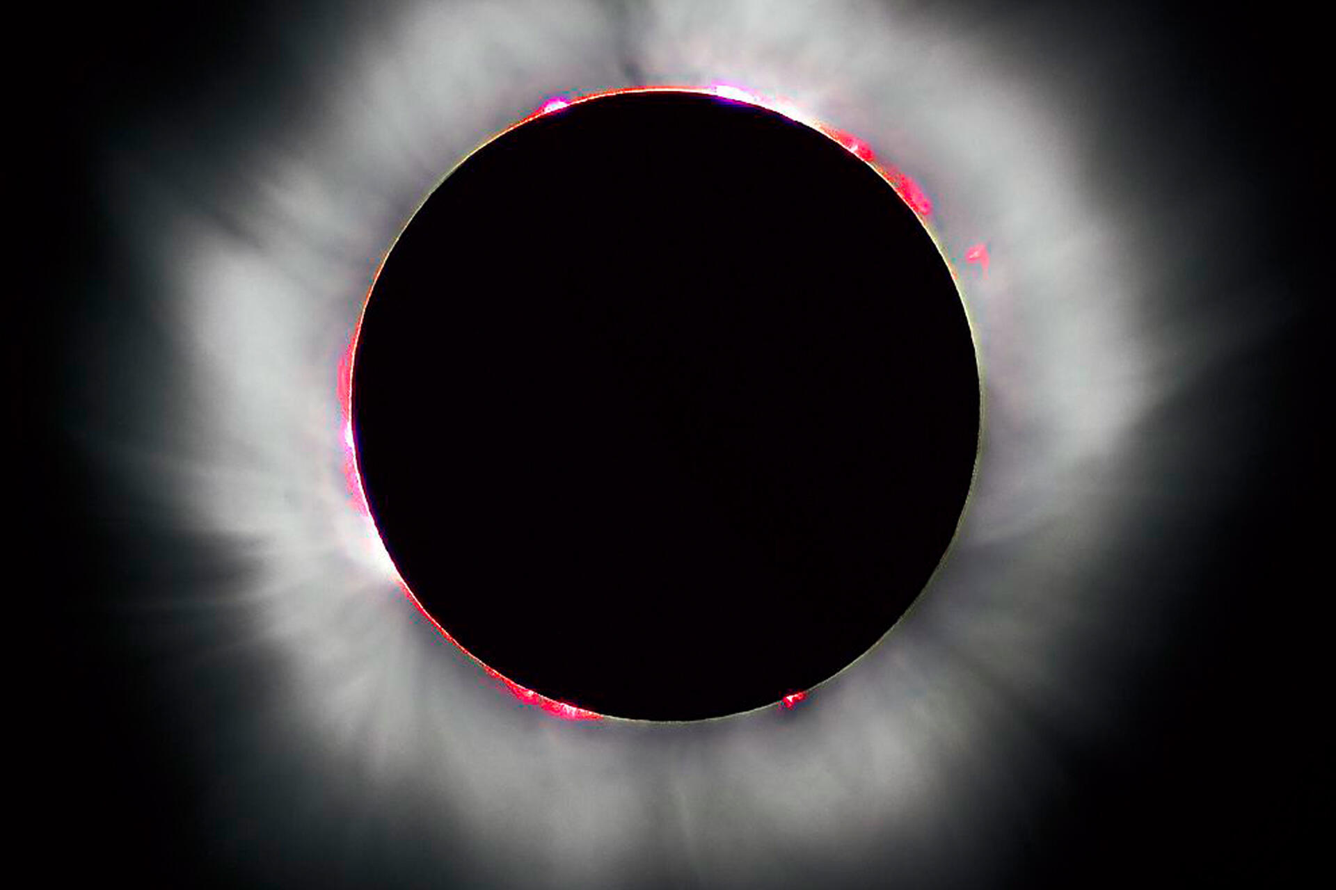 how do astronomers predict solar eclipses and how often does a total eclipse occur