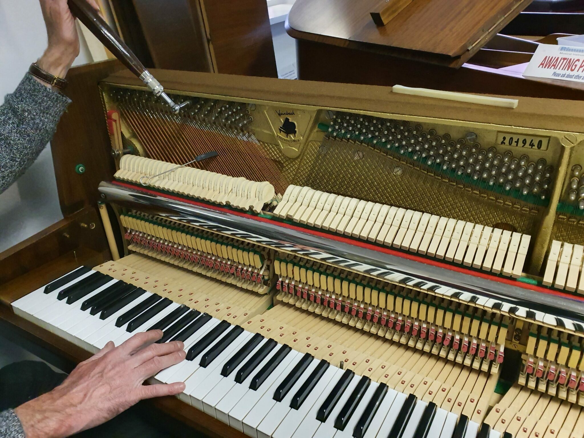 how do piano tuners tune a piano using a tuning fork and intervals scaled