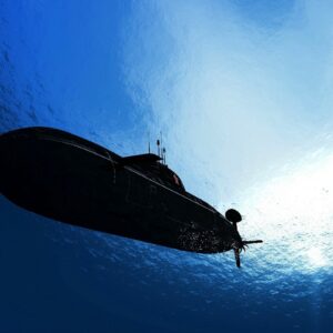 how do submarines change their buoyancy to sink and float