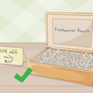 how do you tell real pearls from imitation pearls by rubbing them on your teeth scaled
