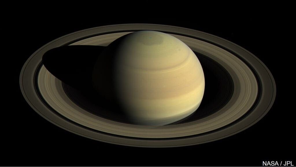how large are the rings around the planet saturn and how far from the surface of saturn do the rings extend