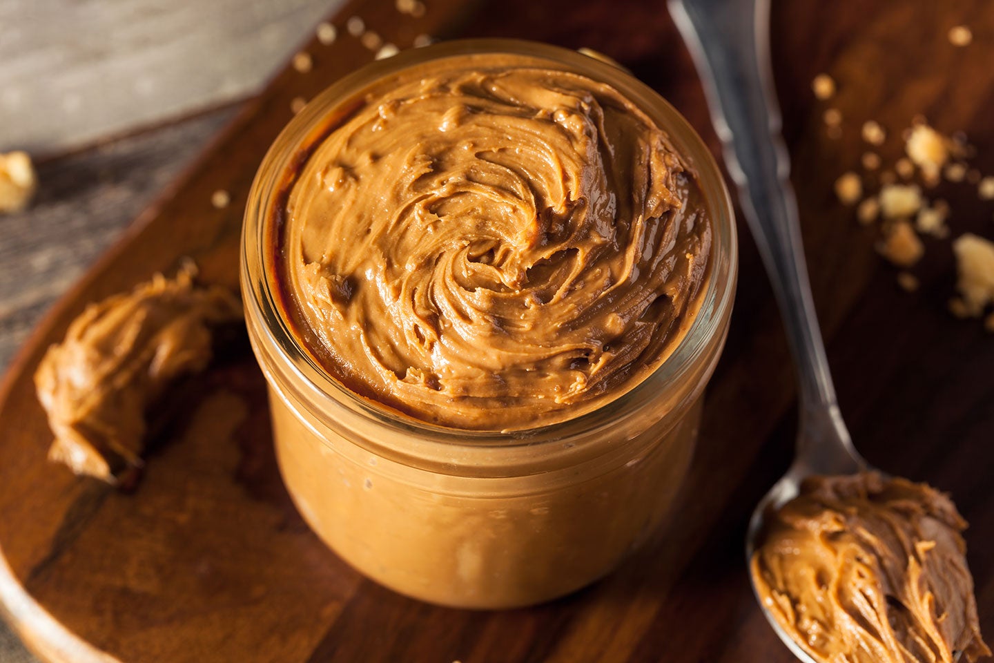 how many peanuts are in a jar of peanut butter and how much peanut butter do americans eat