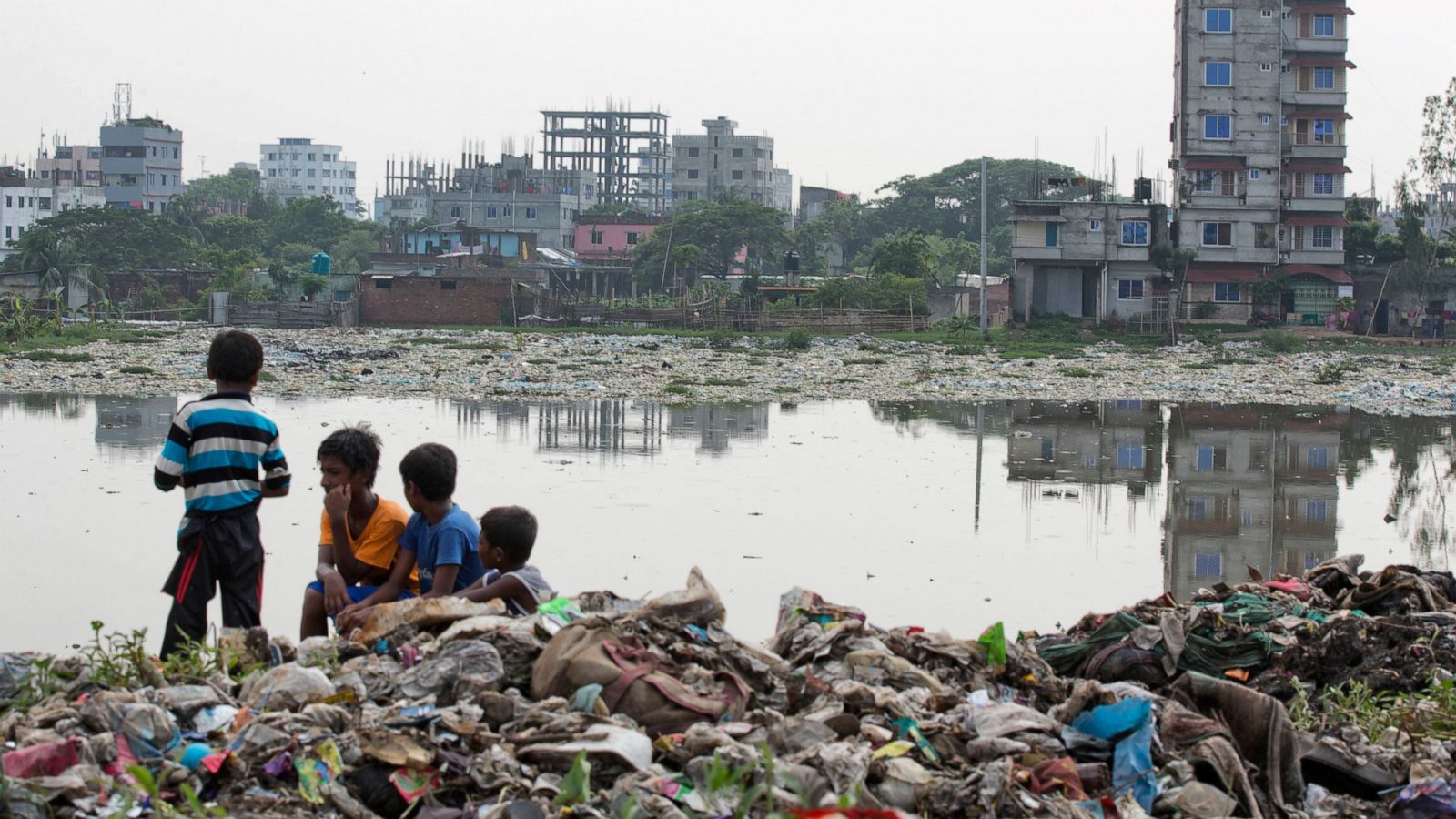 how many people live in bangladesh and why does bangladesh have so many cyclones and floods