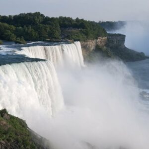 how was niagara falls formed and is niagara falls located in the united states or canada