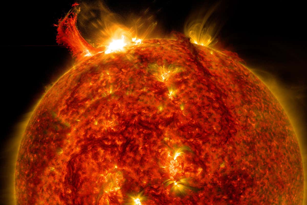 what causes solar wind and what is the difference between solar wind and solar flares