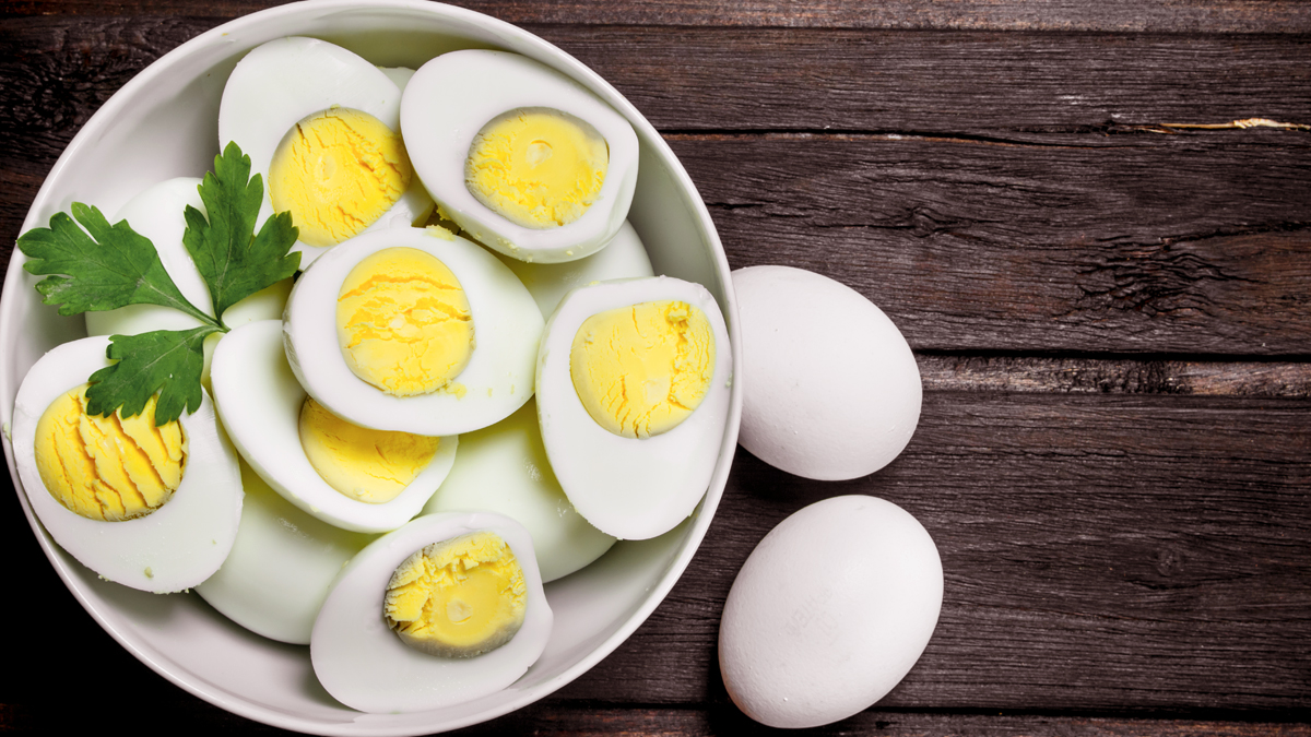 what causes the greenish black grey color of hard boiled egg yolks and are they safe to eat