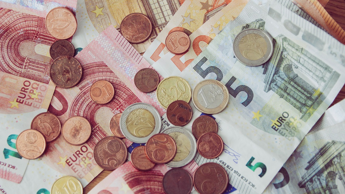 what is a euro and when were euro bills and coins introduced as official currency in europe