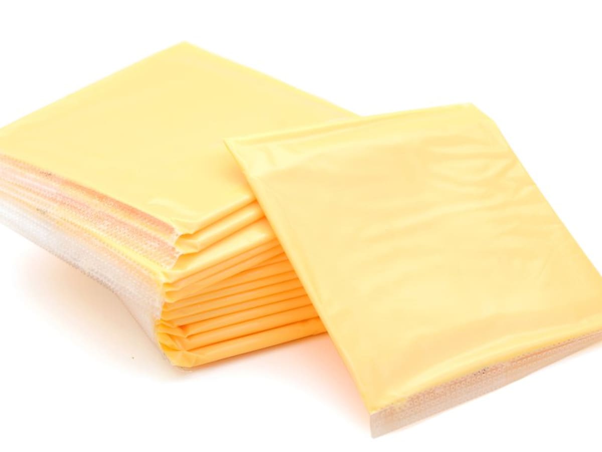 what is the difference between processed cheese and real cheese and how is artificial cheese made