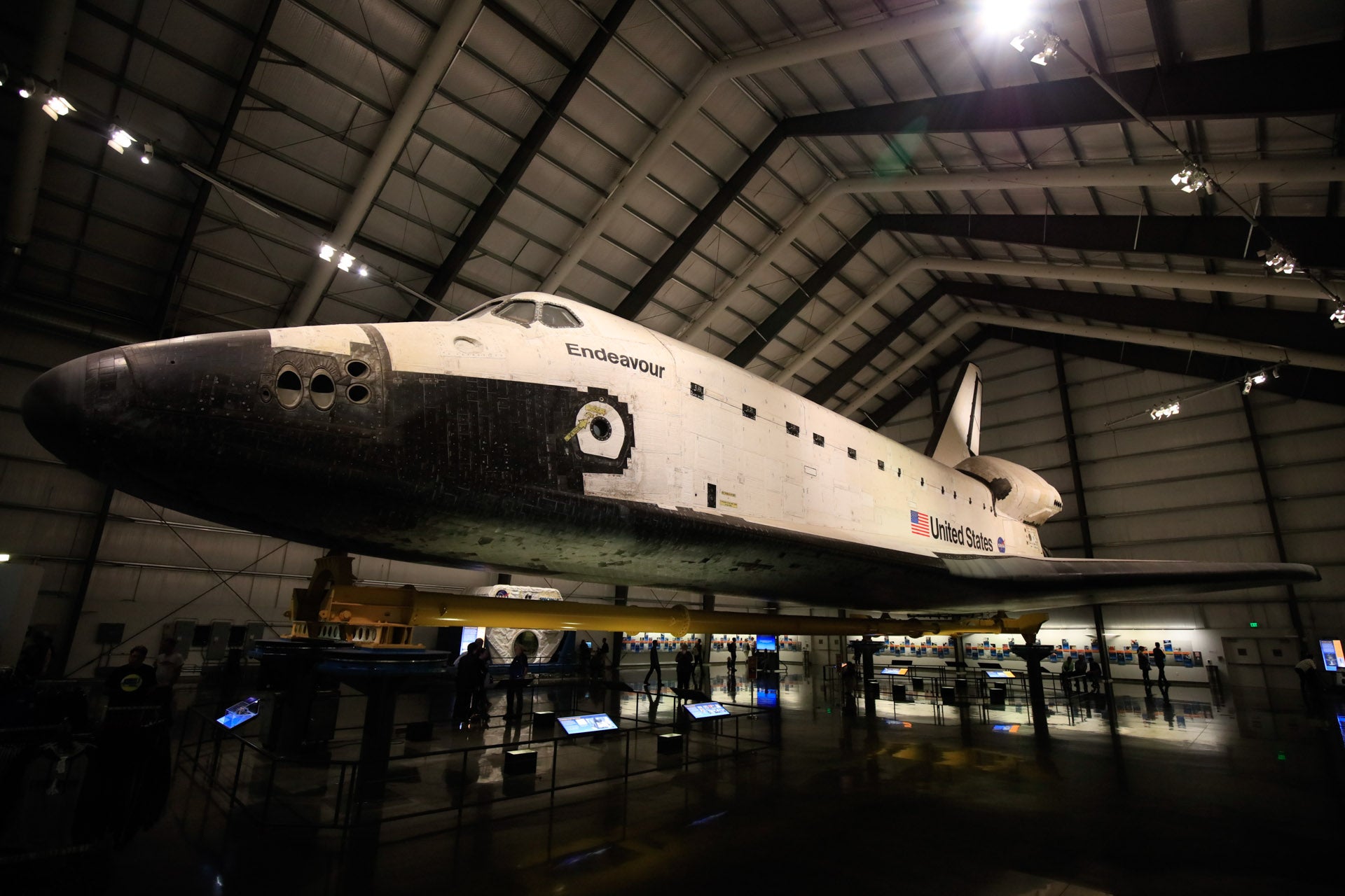what was the space shuttle originally designed for and how many astronauts can the space shuttle carry