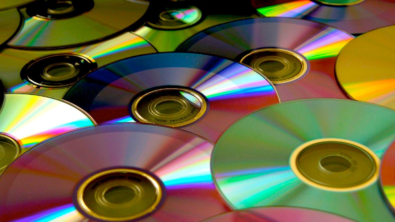when was the compact disc invented and how do they get the music onto a cd