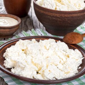where did cream cheese and cottage cheese come from and how are they made