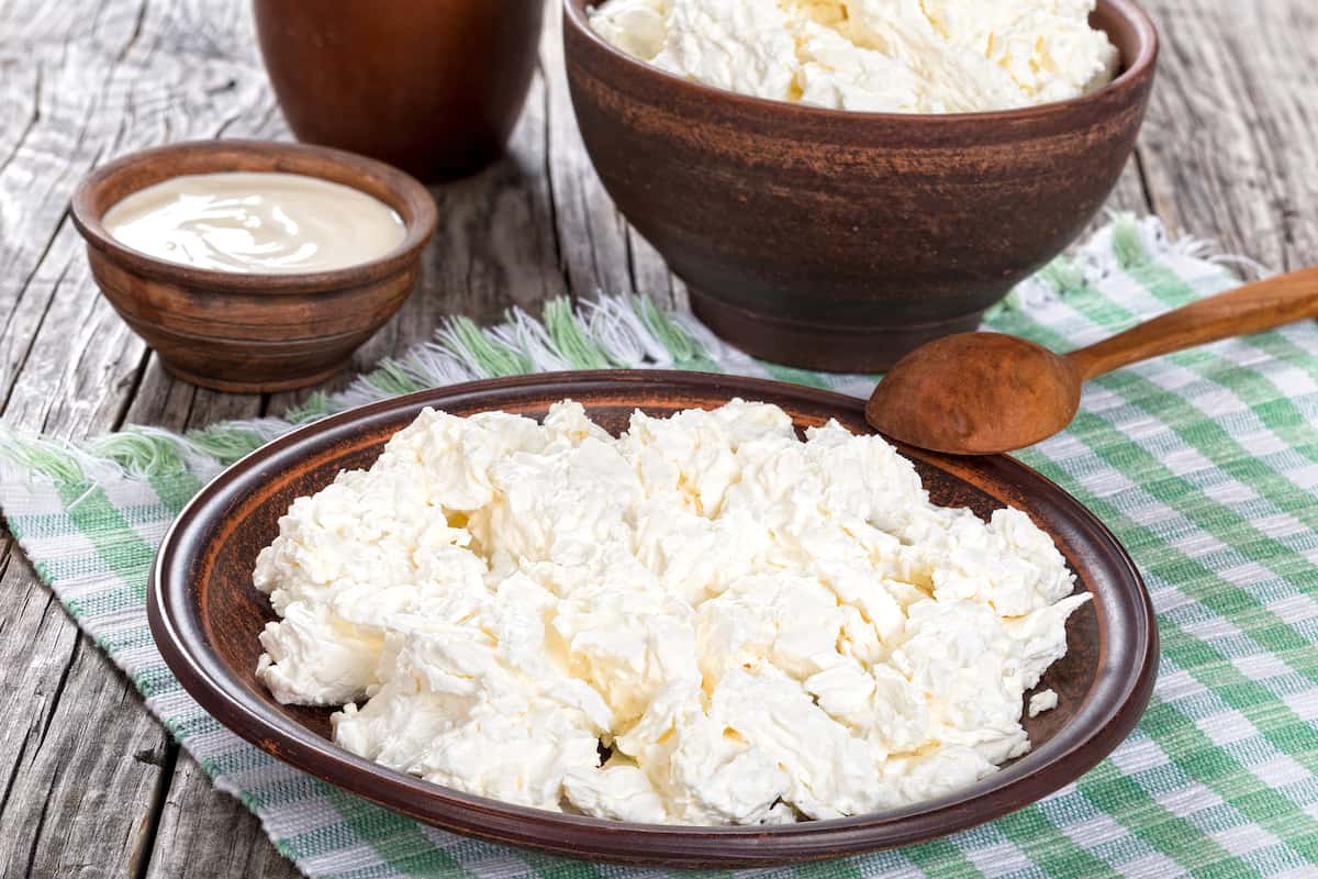 where did cream cheese and cottage cheese come from and how are they made