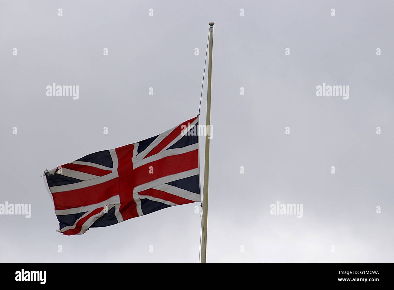 where did the tradition of flying flags at half staff come from and what does the custom mean