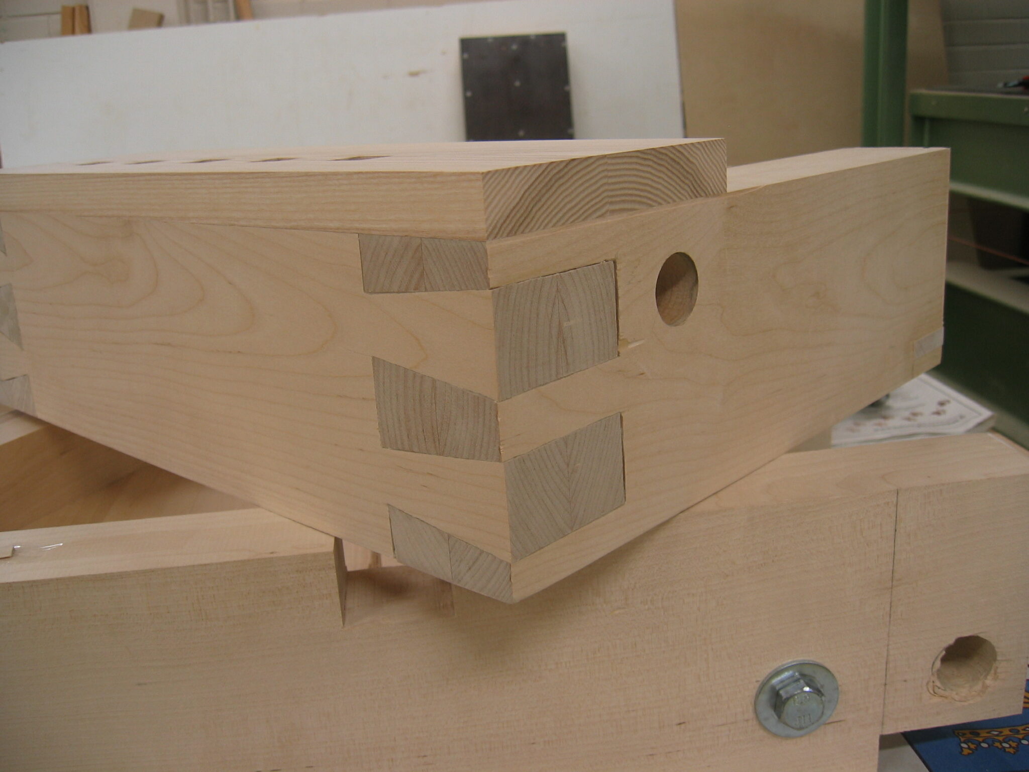 where does the term dovetail come from and what does dovetail mean