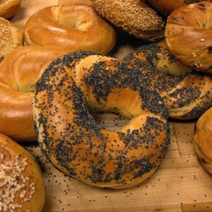 who invented the bagel where did the bread roll come from and what does bagel mean in polish