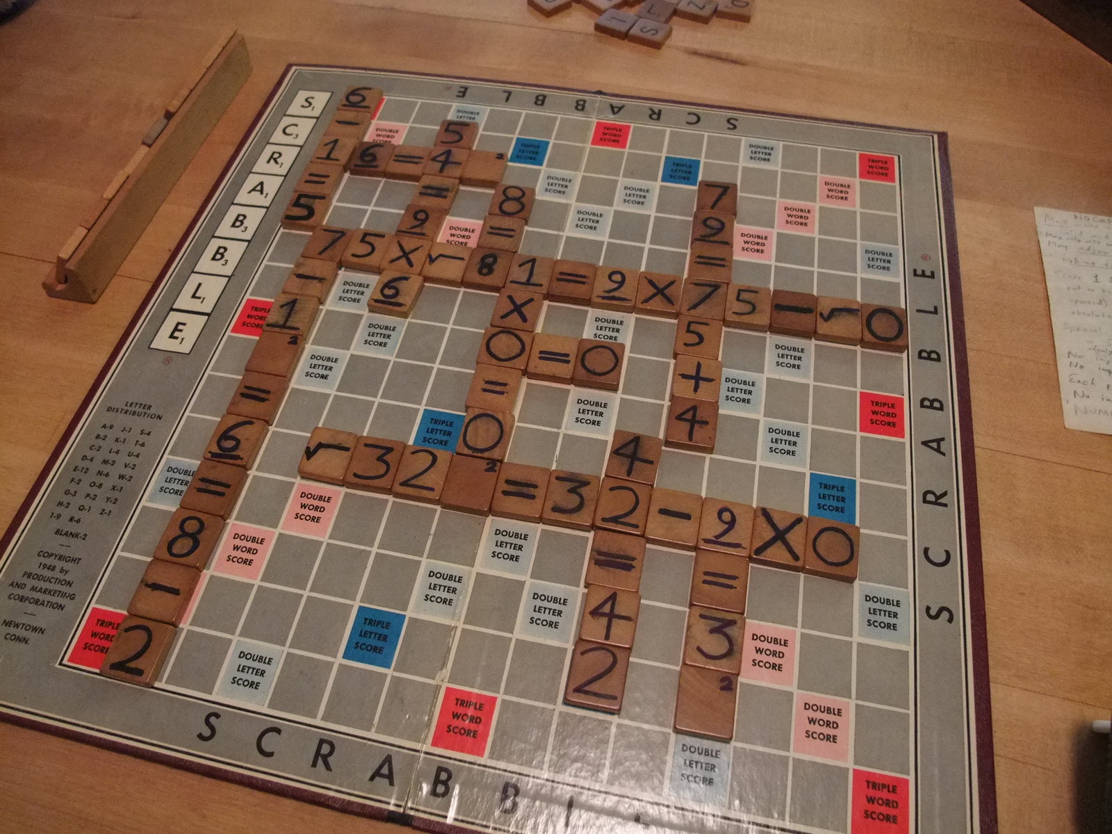 who invented the game scrabble and how were the values for the letters determined