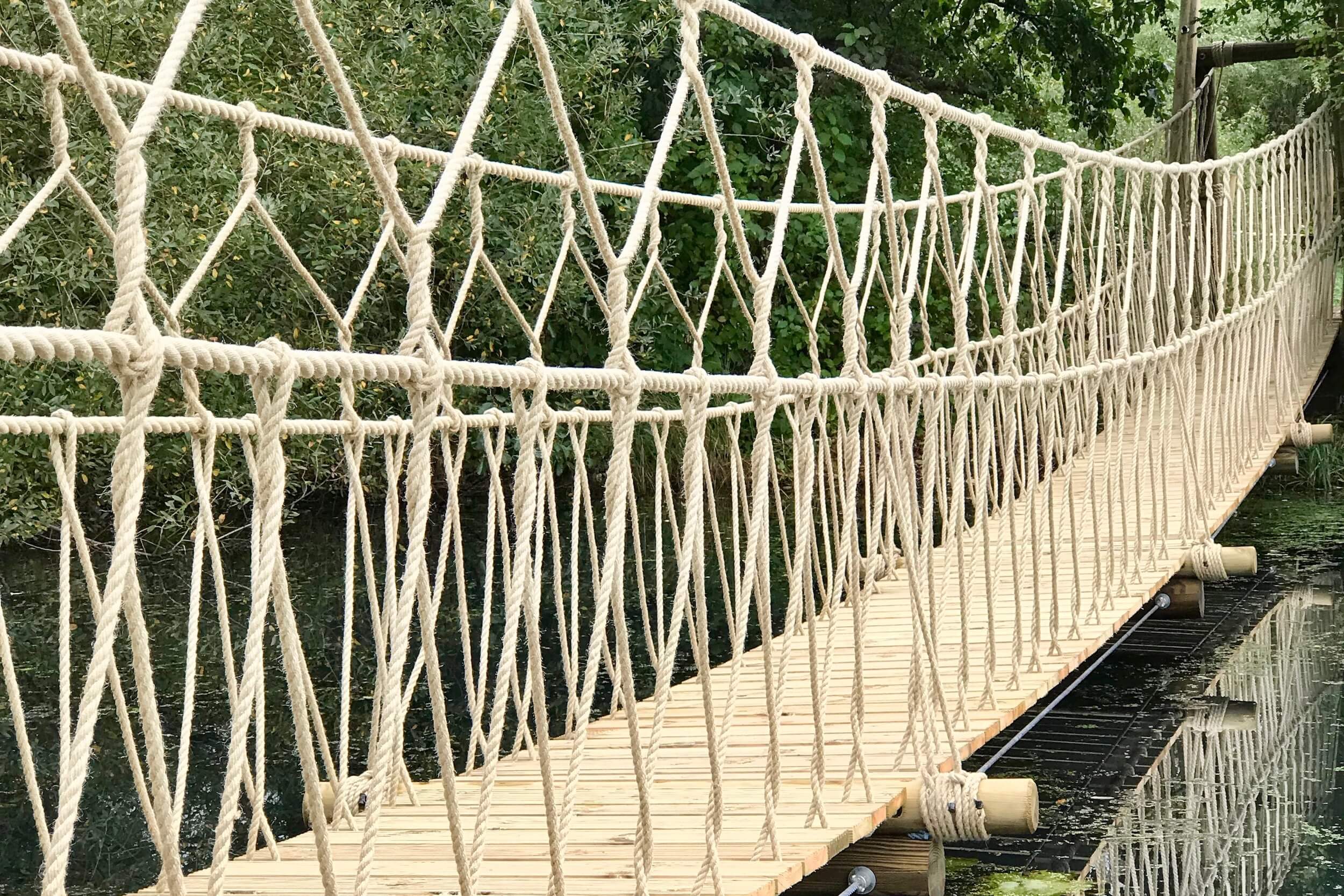 who invented the suspension bridge and how do engineers suspend suspension bridges