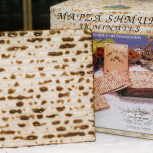 why are matzos shaped like corrugated cardboard and what are they made of