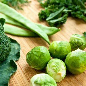 why do green vegetables turn a dull drab color when i cook them and what causes it scaled