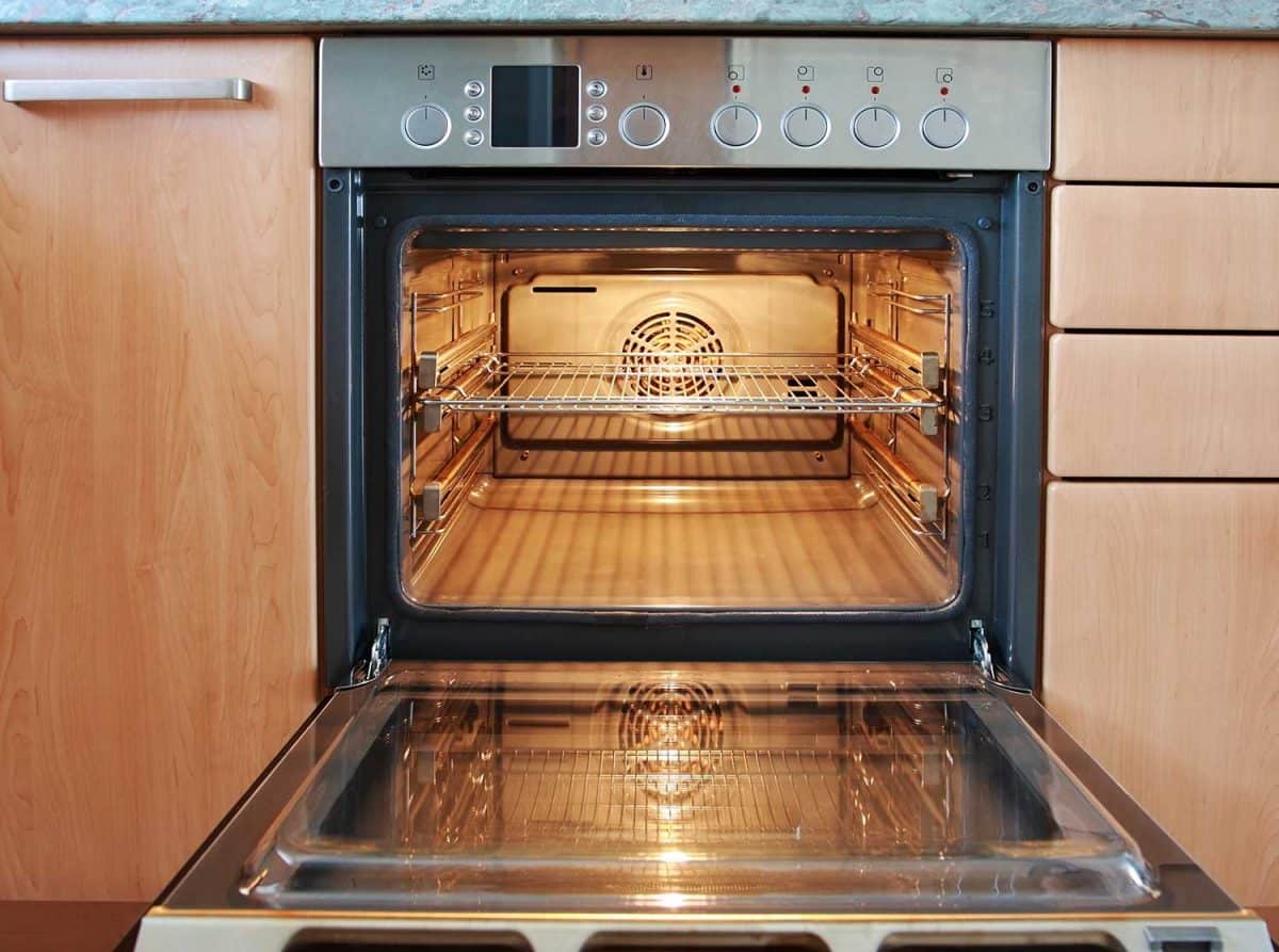 why do microwave ovens cook so much faster than conventional ovens
