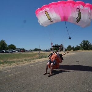 why do parachutes have a big hole at the top of the canopy and how does it reduce the drag on the chute