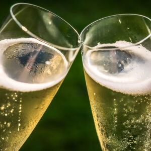 why does a glass of champagne have smaller and fewer bubbles than a glass of beer scaled