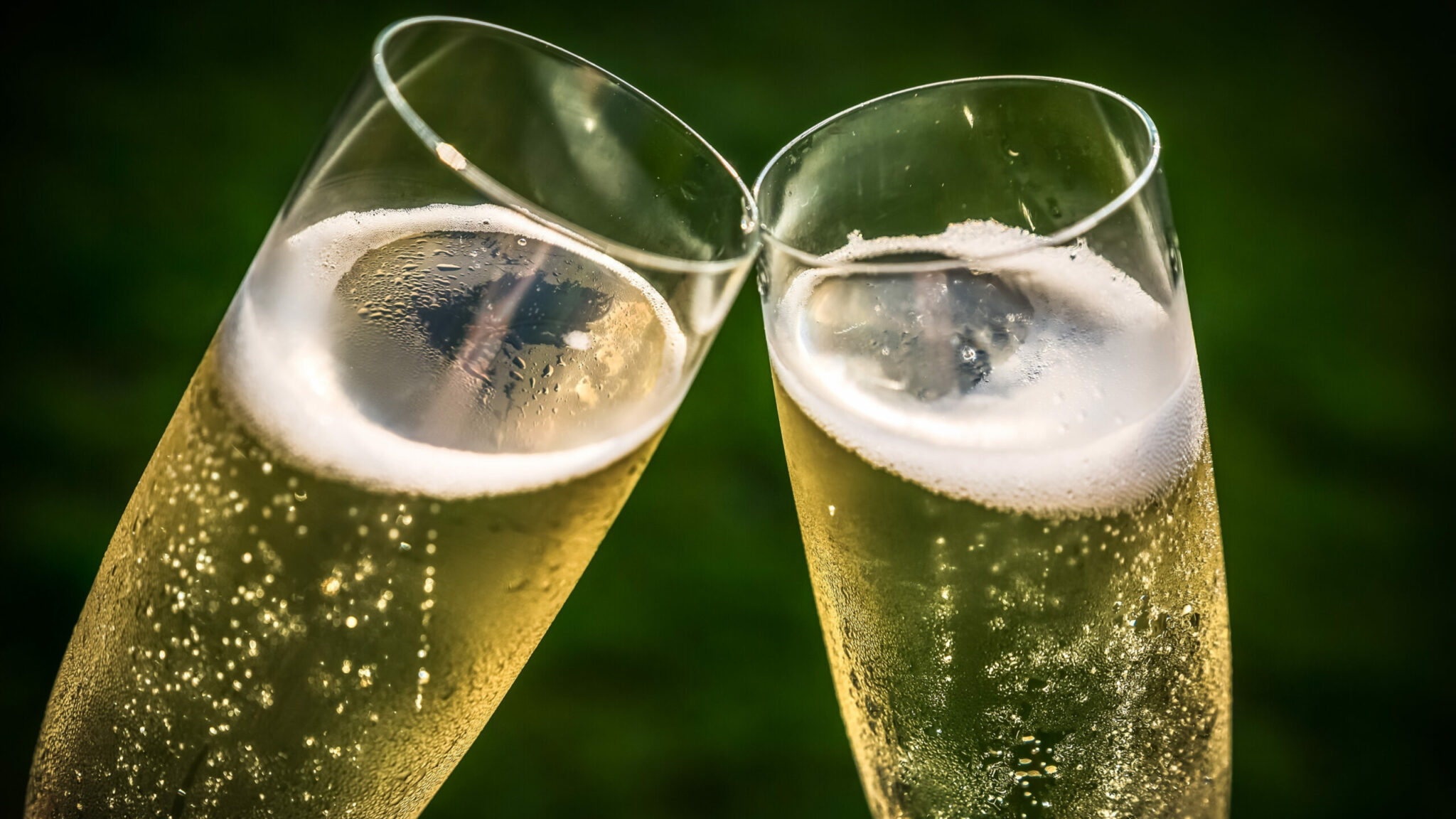 why does a glass of champagne have smaller and fewer bubbles than a glass of beer scaled