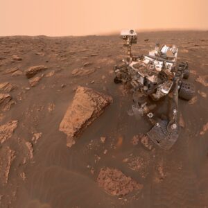 why does mars appear red and and what is the fine dust on the surface of the planet mars made of