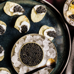 why is caviar served with a special fancy spoon made of gold