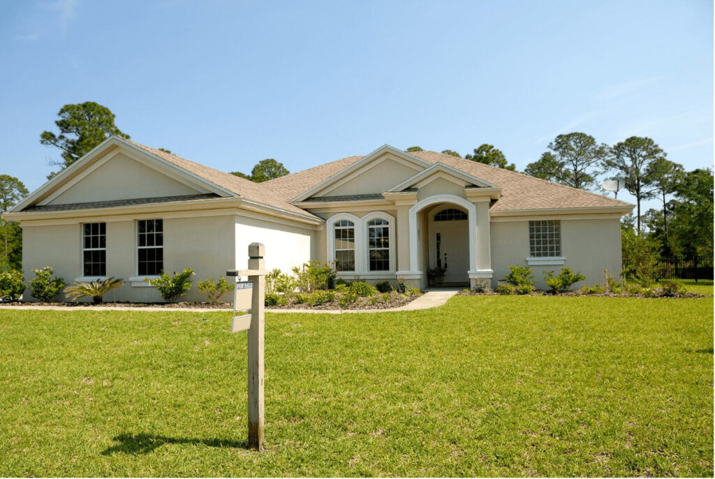 white and brown concrete bungalow