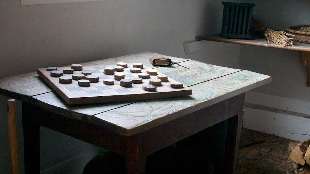 checkers board on an old table