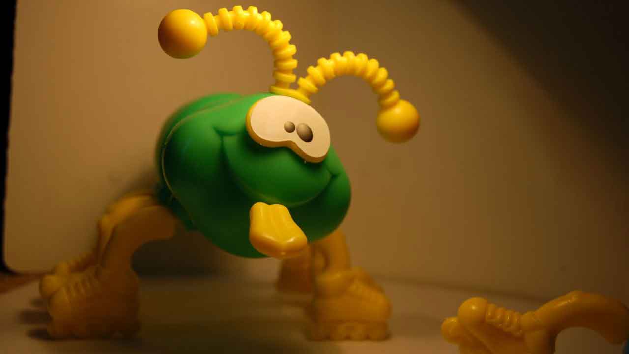 green cootie toy